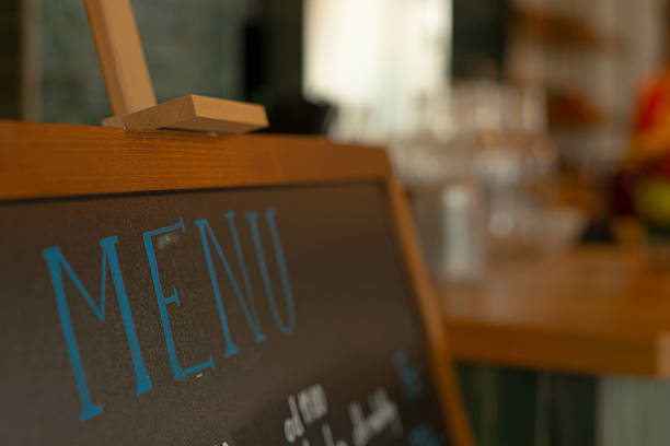 Interior wall plaque showcasing specials with artistic lettering and accents. Traditional rustic menu board illustrating handwritten dishes with emphasis on daily specials and decorative elements