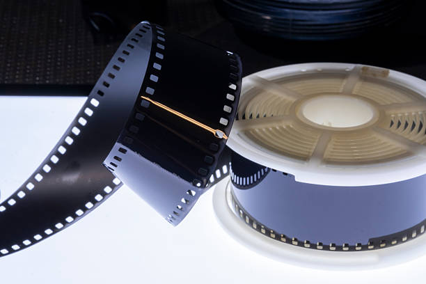 Film strip template with three blank or empty frames, developed 135 type or 35mm film placeholder on white, real film grain