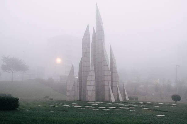 Maia , portugal; august 19, 2024: modern abstract monument standing in a park covered by thick fog