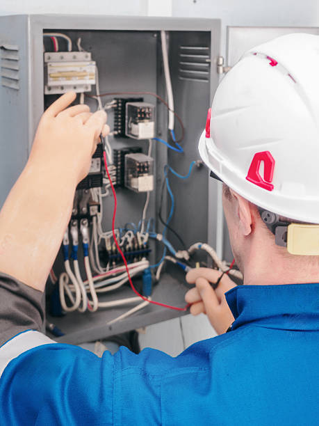 istock Electrician Working on Control Panel with Wiring Connections 2261070747