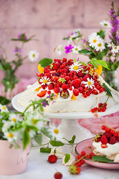 Delicious Pavlova meringue cake decorated with fresh summer berries