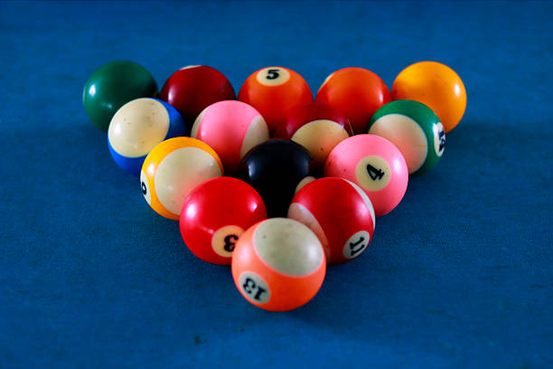 ball with numbers one through five in one line on a billiard table, playing billiards, playing eight in a billiard room, training for playing billiards, tricks on a billiard table