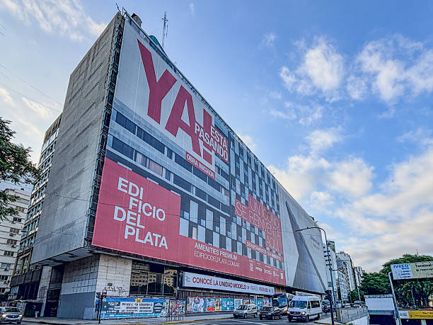 Facade of the Edificio del Plata with construction signage and urban renewal on 9 de Julio Avenue and Peron street in Buenos Aires, Argentina.