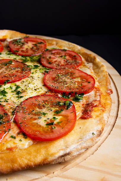 Neapolitan pizza with tomato and cheese