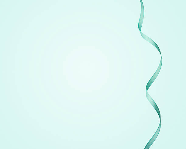 Turquoise ribbon curl on pastel blue background with copy space