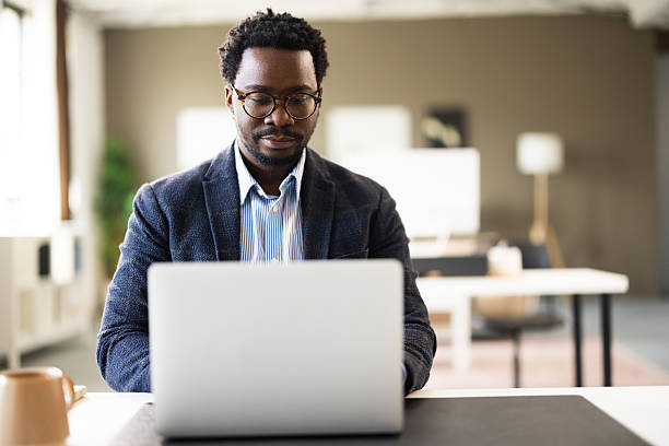 istock African american man working on laptop in modern office 2261126740
