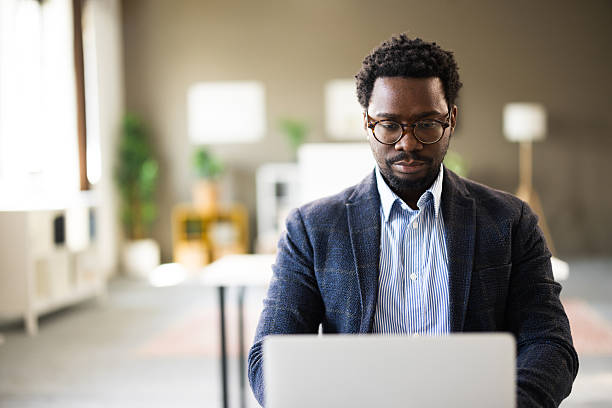 istock African american man working on laptop in modern office 2261126746