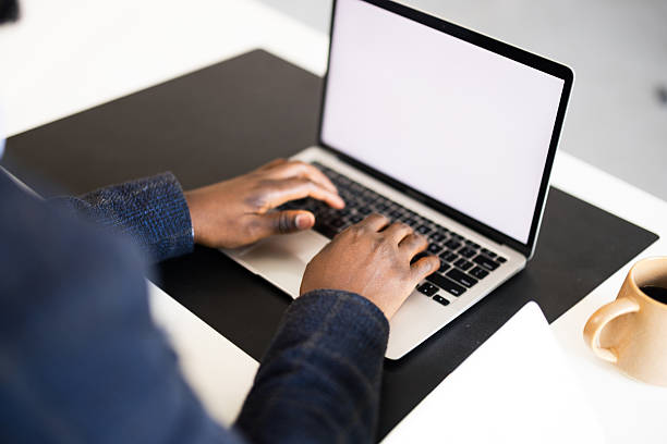 hands typing on laptop keyboard or business person using smart device working on internet communication