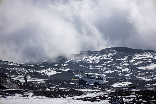 Mount Etna, Italy on November 10, 2025: View of a bus transporting visitors up Mount Etna in Sicily to 2,500 meters above sea level. The shuttle provides access to the volcanic slopes, lava formations, and scenic high-altitude landscapes of one of Europe’s most famous active volcanoes.