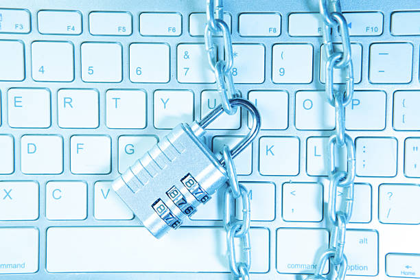 Cybersecurity and protection concept with pad lock and lap top
