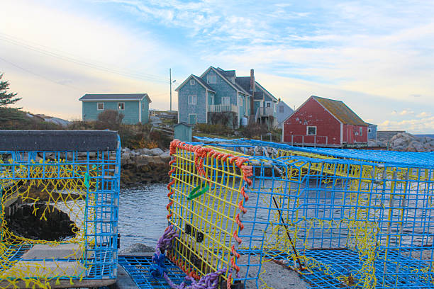 Peggy's Cove, Canada - November, 2025: Sunset at the Peggy's Cove Lighthouse, in the famous fishing town with the same name. It's located in the maritime province of Nova Scotia, on Canada's East Coast. Nowadays Peggy’s Cove is considered a major tourist attraction in the Maritimes.