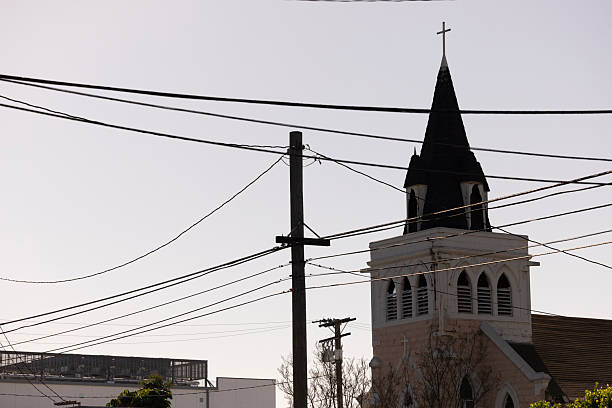 Afternoon sun shines on a historic church and surrounding cityscape of Vernon, California, USA.