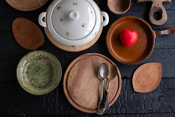 Ceramic tableware and tea set on wooden table, cozy still life