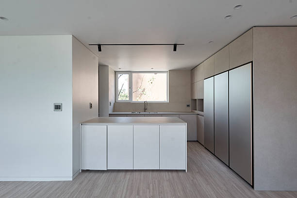 Clean residential interior featuring a sink area and simple built-in surfaces, photographed without people in soft daylight.