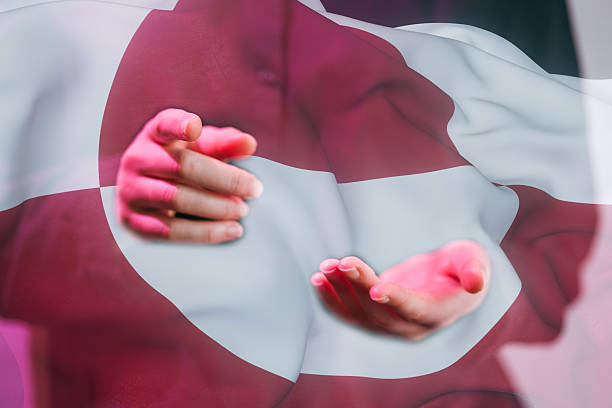 Two hands are extended forward against a large flag featuring red and white colors. The scene suggests a moment of sharing or inviting. The flag adds cultural context to the setting.