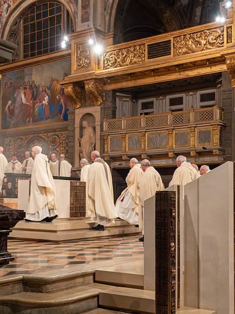 Cremona, Italy - February 2nd 2026 Clergy members, including a bishop and priests, walking in procession during a Catholic Mass liturgy at Duomo di Cremona