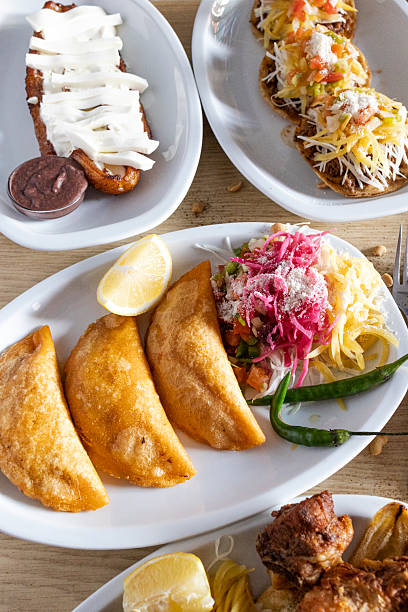 Latin american cuisine serving empanadas, tostadas, and plantain