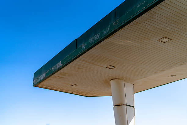 Minimal view of a gas station canopy structure in Giza, Egypt, with clean lines, geometric forms, and blue sky, suitable for architecture, infrastructure, and modern design concepts.