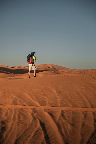 istock Backpacker exploring the vast landscape of the merzouga desert in morocco 2261225749