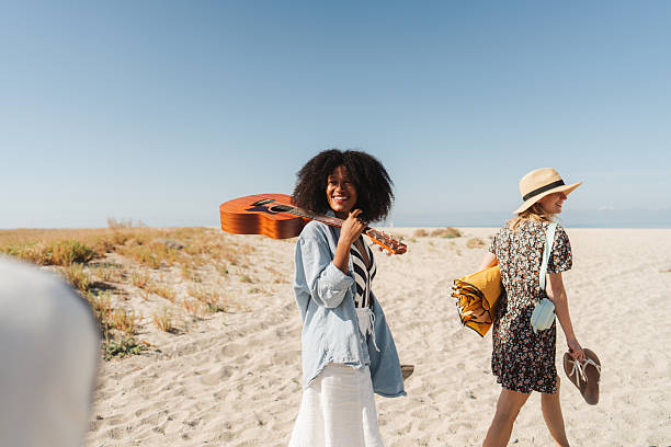 Photo of a couple of young women on their way to the local beach