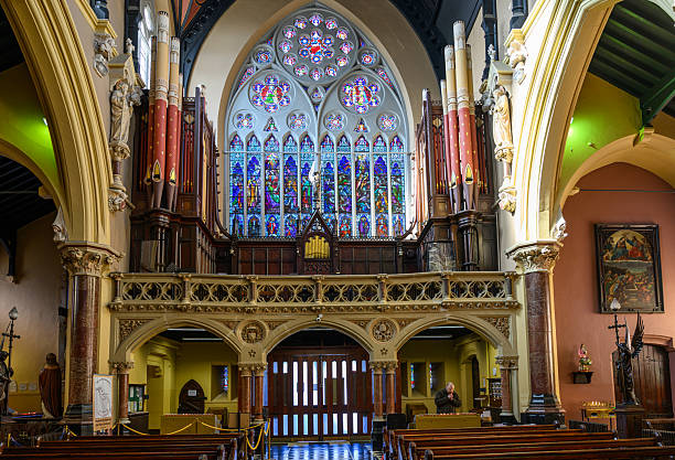 Cork, Ireland - Oct 12, 2024: Saints Peter and Paul’s Church is a historic Roman Catholic church in Cork City, Ireland, known for its striking Victorian Gothic Revival architecture and its long role in the city’s religious and community life.