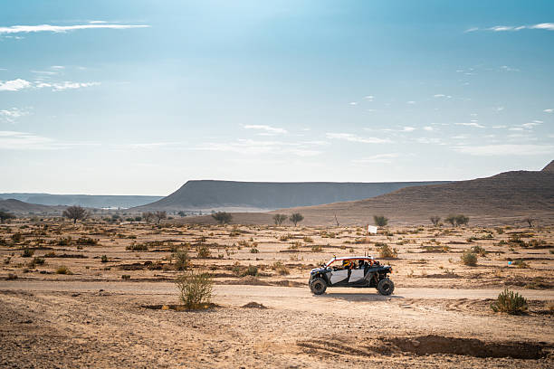 Nawan , Saudi Arabia  Jan 7 2023: 4x4 cars drift across Saudi Arabias striking sand desert. The vehicles perform thrilling maneuvers, on sand dunes