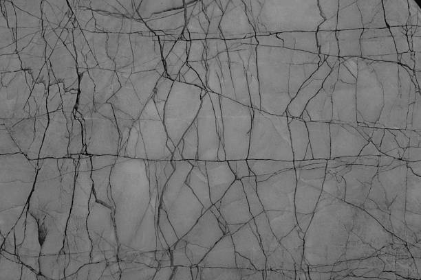 Natural marble texture background with grey surface and dark veins,showcasing abstract stone pattern and elegant mineral detail for luxury interior design,architecture decoration,modern construction.