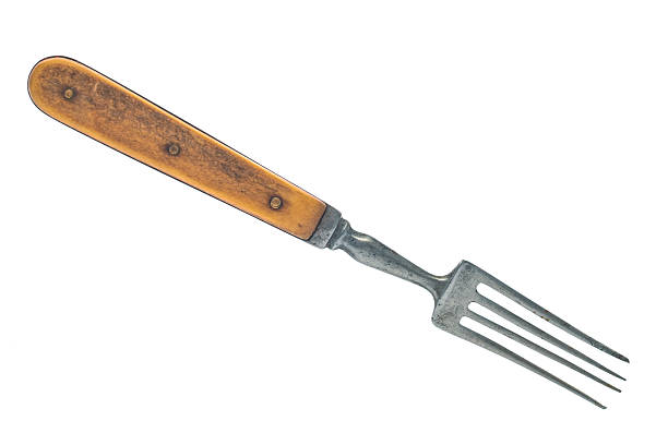 Antique fork close up isolated on white background