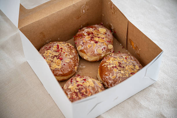 Box of Glazed Donuts with Almond Flakes