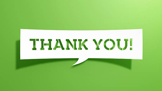 istock A white paper-cut speech bubble with the stencil text THANK YOU! placed on a bright green background. 2261320693
