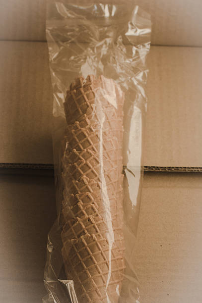 Ice cream wafer cone in plastic on Cardboard