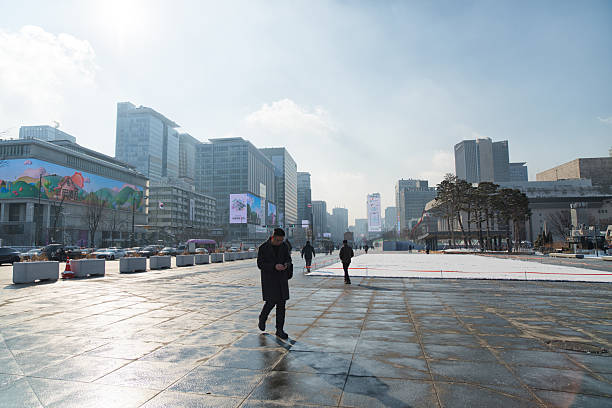 Seoul Korea - February 2nd 2026, Tourists visit the snowy Gwanghwamun Square near Gyeongbokgung Palace in Seoul Korea. 광화문 광장