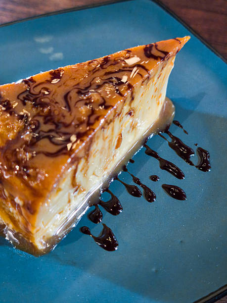A slice of cake with chocolate sauce drizzled on top