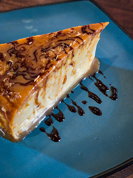 A slice of cake with chocolate sauce drizzled on top