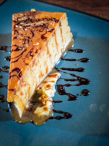 A slice of cake with chocolate sauce drizzled on top