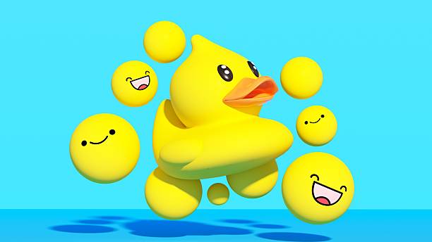 This playful three-dimensional illustration depicts a classic yellow rubber duck floating amidst a cloud of happy smiling emojis and yellow spheres. The bright blue background enhances the cheerful and lighthearted atmosphere, symbolizing fun, childhood nostalgia, or perhaps a viral social media trend. The composition blends the innocence of a toy with the modern language of digital emoticons, representing positive vibes and entertainment. An excellent visual for parenting blogs, toy marketing, social media apps, or brands looking to add a touch of humor and joy to their messaging. Perfect for conveying happiness, leisure, and playful interaction.