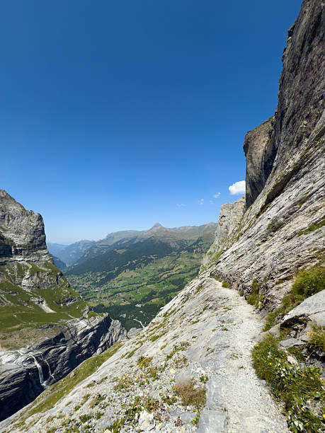 Aerial view of mountain biker on mountain ridge, Swiss Alps