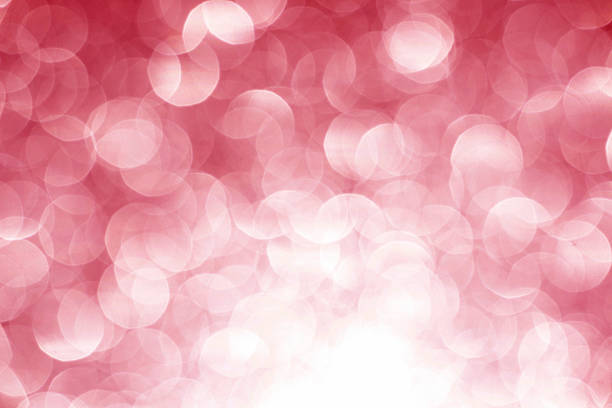 istock pink, red white glittering Christmas lights. Blurred abstract background 2261359239