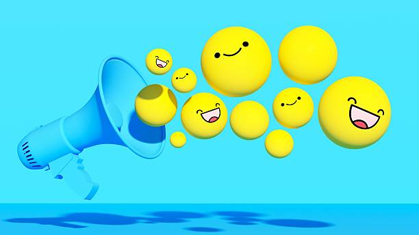 This vibrant three-dimensional illustration features a stylized blue megaphone projecting a dynamic stream of floating yellow spheres and happy smiling emojis. Set against a clean blue background, the playful composition symbolizes positive communication, broadcasting good news, and effective audience engagement on social media platforms. The cheerful faces represent customer satisfaction, viral content, and successful digital marketing strategies. The modern, minimalist design highlights the power of voice and connectivity in the digital age. Perfect for social media agencies, influencer campaigns, app notifications, and business advertisements. Ideal for brands seeking to convey a friendly, energetic, and connected message to their online community.