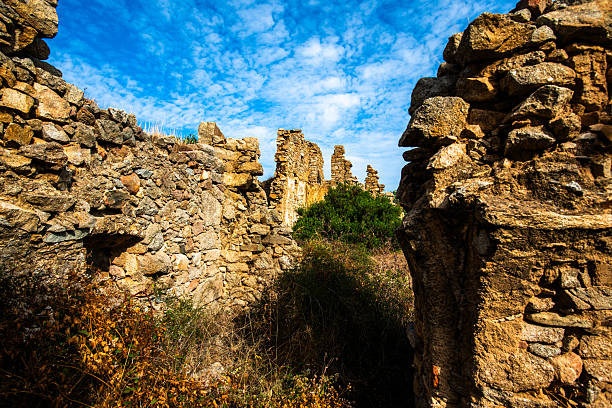 Valeggio, Italy- august 31 2025: A Dramatic Low Angle View Showing The Weathered Brick And Stone Walls Of Castle Tower Ruins, Valeggio Sul Mincio, Italy.