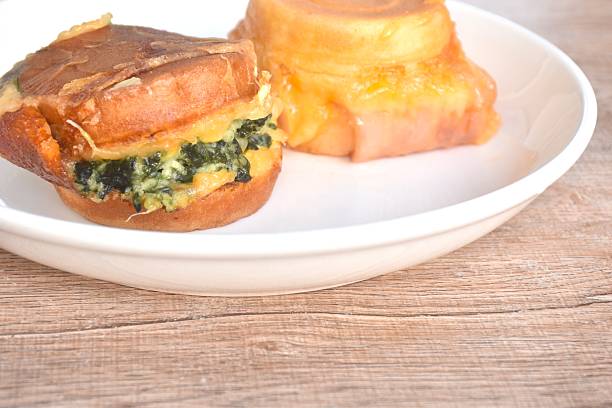 Obanyaki grilled Japanese pancake stuffed spinach and chicken ham with cheese