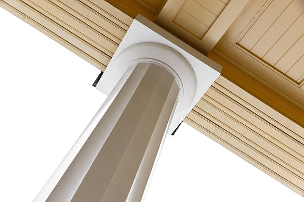Yellow columned arcade with tall white pillar and crown molding isolated on white background. The warm yellow ceiling adds depth and elegance to a stately architectural setting