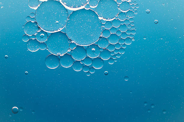 istock Aqua water drops on turquoise surface-Underwater background with air bubbles 2261439663