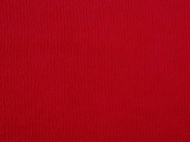istock Close-up texture of vibrant red fabric background 2261456925