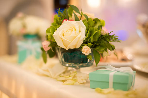 Sweet romantic dinner. Daisies flower in the glass with beautiful bokeh light make the dinner have very special feeling.