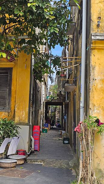 A vibrant Hoi An street scene with colorful ornate architecture and typical lanterns everywhere
