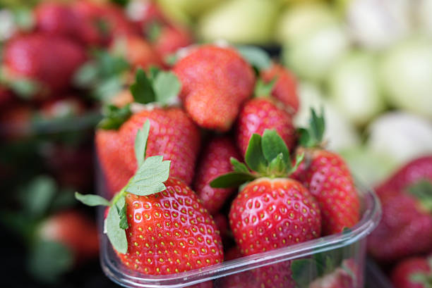 Fresh organic red ripe Strawberry fruit background closeup