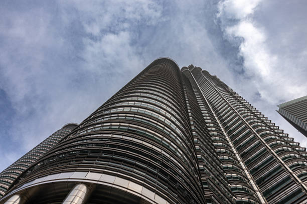 High angle skyscraper view, Petronas twin towers with cloudy blue sky background.Kuala Lumpur - Malaysia.