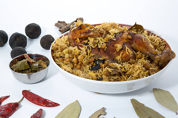 Delicious traditional Middle Eastern Chicken Machboos or Chicken Biryani with spices and herbs side view