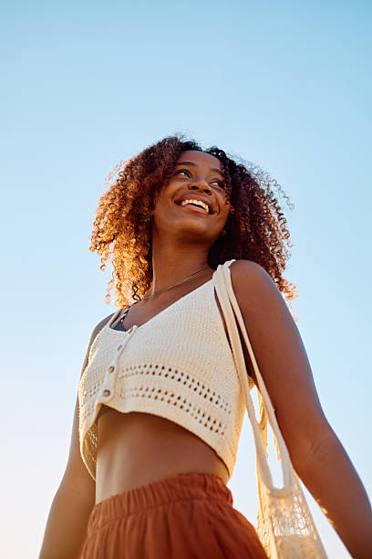 Young woman smiling enjoying summer freedom outdoor
